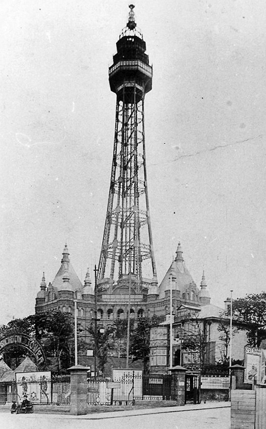 The New Brighton Tower in the early 1900s, a tall steel lattice tower rising above the resort buildings